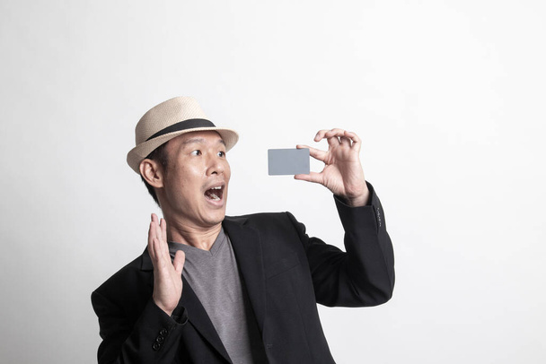 Adult Asian man  happy with  blank card on white background - Valokuva, kuva