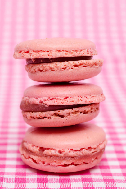 Red marcarons with strawberry filling - 写真・画像