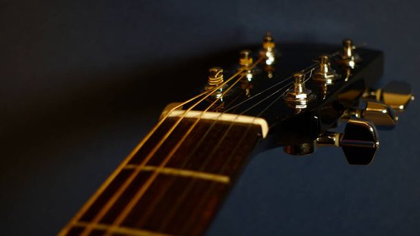  guitar headstock closeup . dark background . with copy space  - 写真・画像