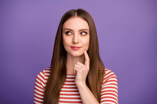 Closeup photo of attractive funny lady long hairstyle intelligent student look interested side empty space arm on chin wear casual striped shirt isolated pastel purple color background - Foto, immagini