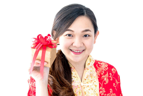 beautiful asian woman holding gift box with red bow isolated on white, chinese new year concept - Photo, Image