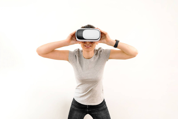 Girl in VR glasses isolated on white background. Extended reality  - Valokuva, kuva