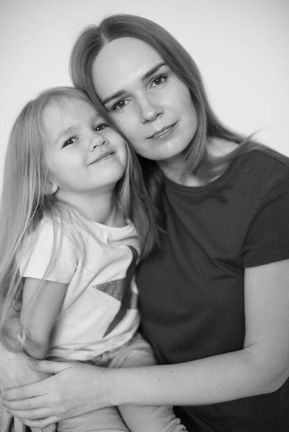 black-white. mother and daughter hug each.  - Foto, imagen