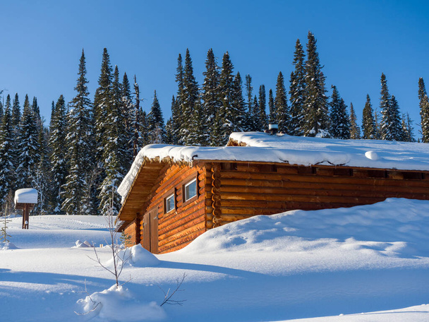 Alpine-style hotel in the ski resort Gornaya Salanga. Chalet in the snow. Winter day - Foto, Imagem