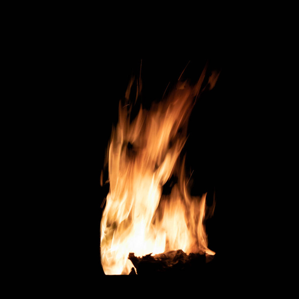 Bright bonfire flame isolated on black background - Photo, image