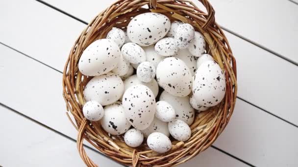 Basket of white dotted Easter eggs in brown wicker basket - Footage, Video