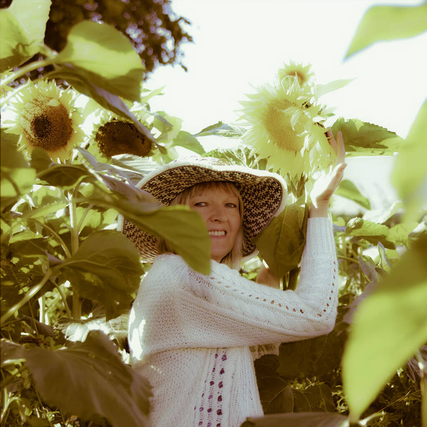 Woman in the Sunflower Field - Фото, зображення