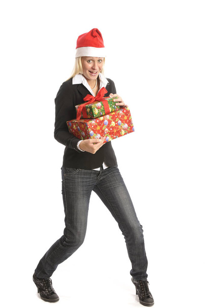Pretty young blonde woman with Christmas tree and gifts against white background - Fotografie, Obrázek