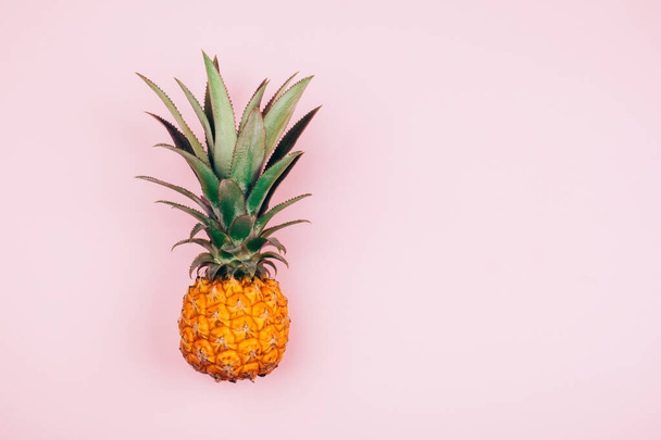 Yellow pineapple on stylish pink background. Flat lay style - Foto, Bild
