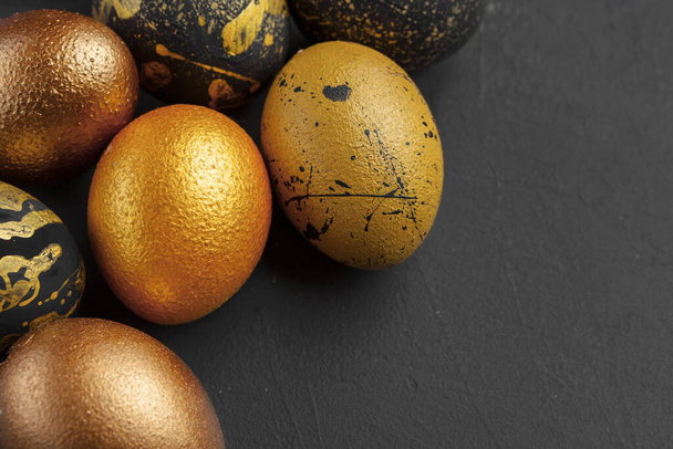 Background with golden decorated easter eggs creative photo. - Foto, immagini