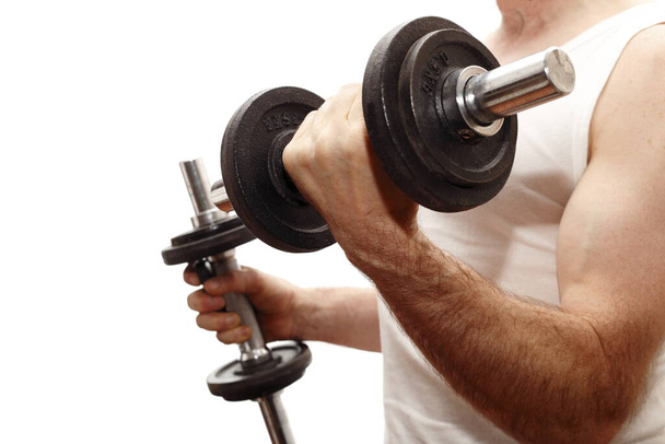 handsome muscular man with dumbbells in the gym - Photo, Image