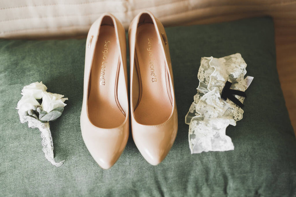 White stylish wedding shoes for bride. Close-up - Фото, изображение