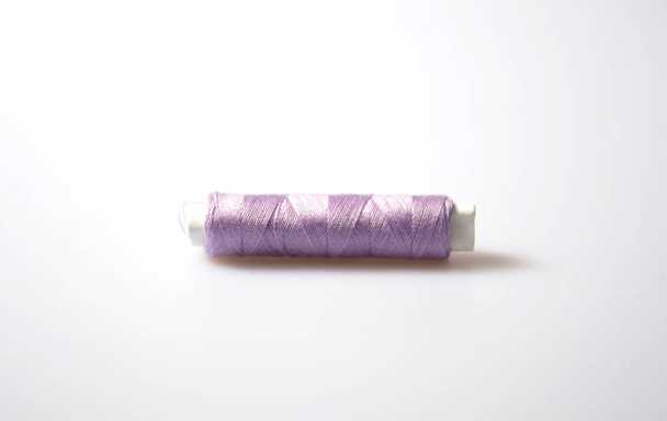 spool of thread on a white background - Фото, зображення
