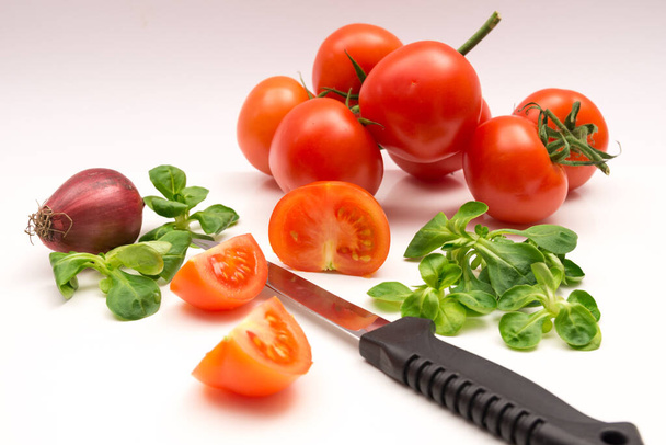 Tomatoes,onion, field lettuce and knives - 写真・画像