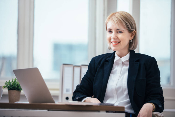 Young woman working in office - Photo, image