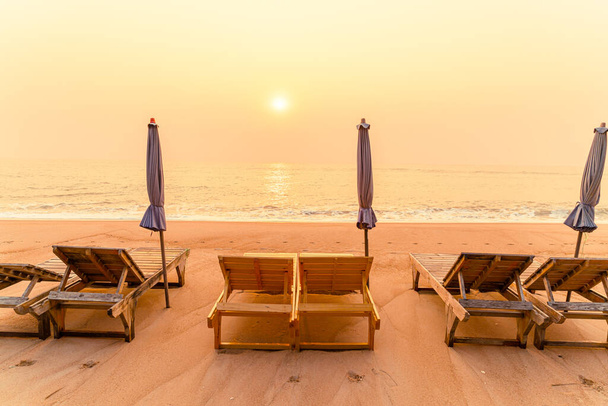 empty beach chair on sand with ocean sea background - Фото, изображение