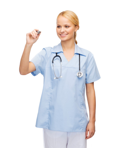 Doctor or nurse working with something imaginary - Foto, Imagen