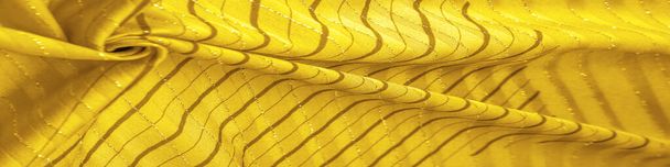 Textura de fundo de design, tecido âmbar amarelo com listras lurex, perfeito para um estilo fresco e confortável. - Foto, Imagem