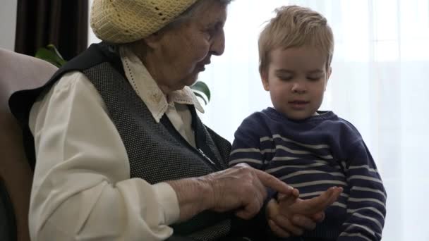 Great-grandmother Plays with Child. Senior Active Woman Having Fun with Great-grandchild. Slow motion 0.5 speed 60 fps - Materiał filmowy, wideo