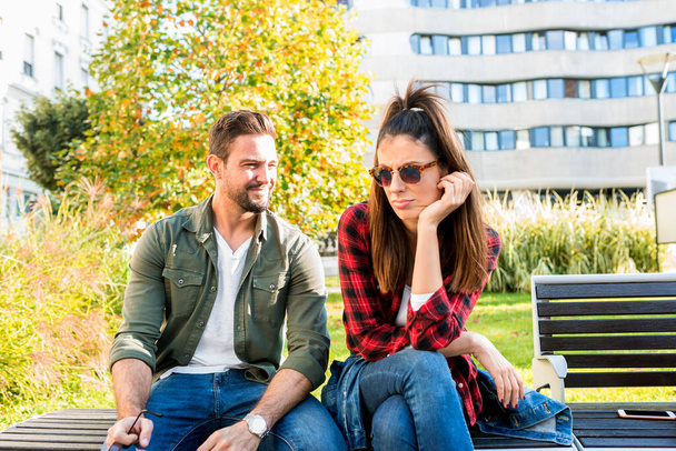 A annoyed couple on a park bench - Valokuva, kuva