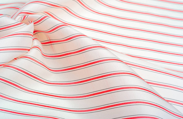 textured pattern, composite textile, dense silk fabric, white with red and gray lines, dash on fabric, narrow stripe. feature, line, stroke, dash, trace, - Photo, Image
