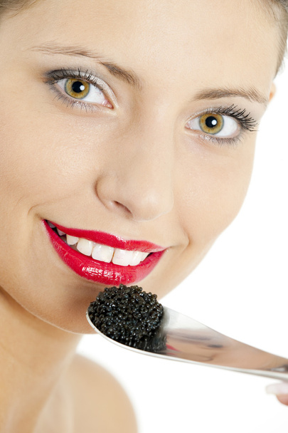 Mujer con caviar negro
 - Foto, Imagen