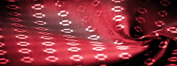 Фон текстуры, рубиново-красный цвет ткани тонкие, сильные, мягкие, блестящие волокна, полученные шелкопрядами в производстве коконов и собранные для производства нитей и тканей
. - Фото, изображение