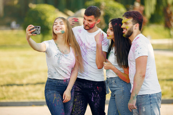 People have fun in a park with holi paints - Φωτογραφία, εικόνα