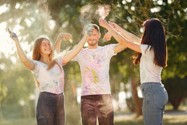 People have fun in a park with holi paints - Fotoğraf, Görsel