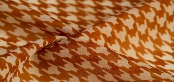 Texture, background, pattern, silk fabric, brown on a white background. pattern on ala fabric of famous french modeler. projects will fulfill your desires you are known - Photo, Image