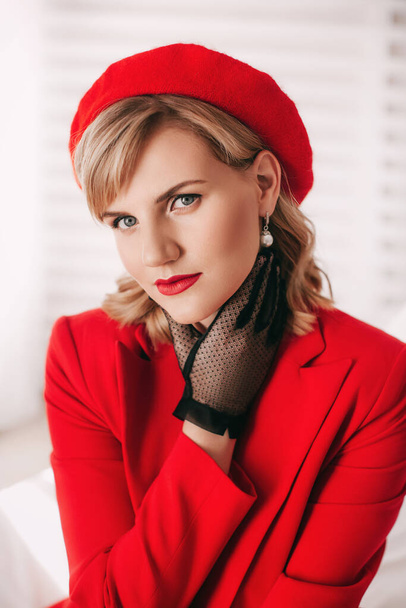 portrait of  beautiful blond woman in red costume - Fotografie, Obrázek