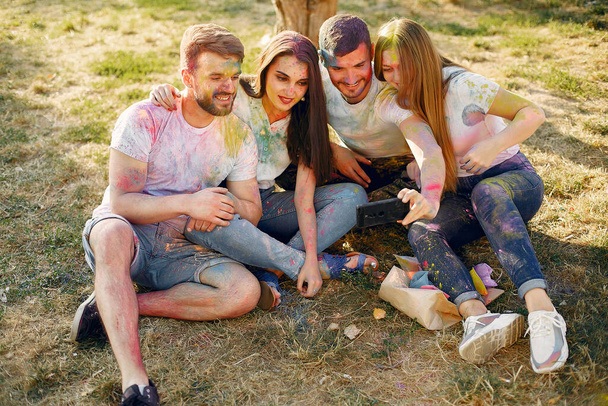 People have fun in a park with holi paints - Fotoğraf, Görsel
