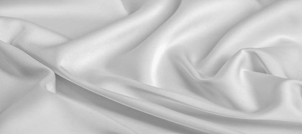 Taustan rakenne, kuvio. Valkoinen silkkikangas. Se on sileä matta viimeistely ja saa voimansa hieman kierretty lankoja. käytä tätä ylellistä kangasta mihinkään
 - Valokuva, kuva