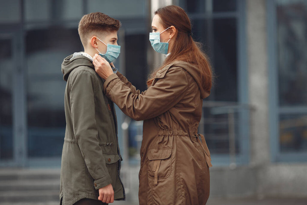 A boy and mother are wearing protective masks - Photo, Image
