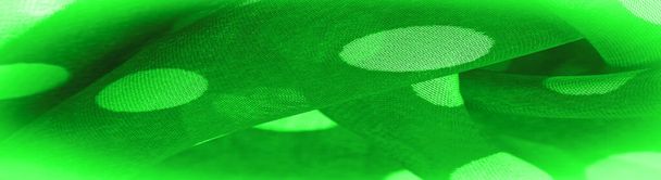 Фон текстуры, декоративный орнамент, зеленый горошек ткани, круглые точки на ткани, которые имеют форму или примерно напоминают круг или цилиндр. - Фото, изображение