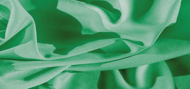 Tekstuuri, tausta, silkkikangas, vihreä naisten huivi Kätevä projekteillesi, taustakuvakorttien suunnittelu - Valokuva, kuva