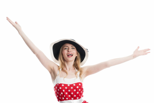 woman in rockabilly style and hat gesticulated and is happy about success - Foto, Imagen