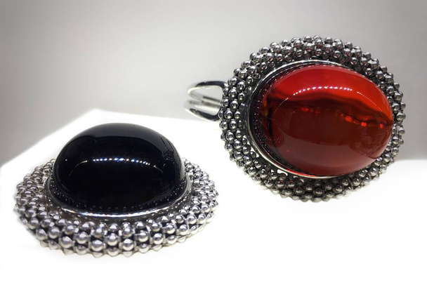 Expensive silver jewelry with red Mexican amber. Template for jewelry store design. - Photo, Image