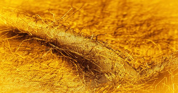 Textura de fundo, ornamento decorativo, tecido de seda de ouro amarelo, fios tecidos no tecido, efeito fofo, sensação, aparência ou textura de uma superfície ou substância - Foto, Imagem