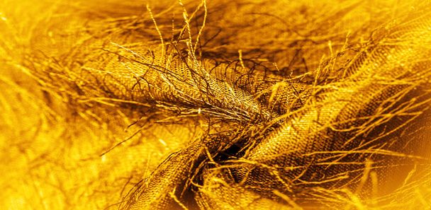 Фон текстуры, декоративный орнамент, желтое золото шелковой ткани, тканые нити на ткани, пушистый эффект, ощущение, внешний вид или текстуру поверхности или вещества - Фото, изображение