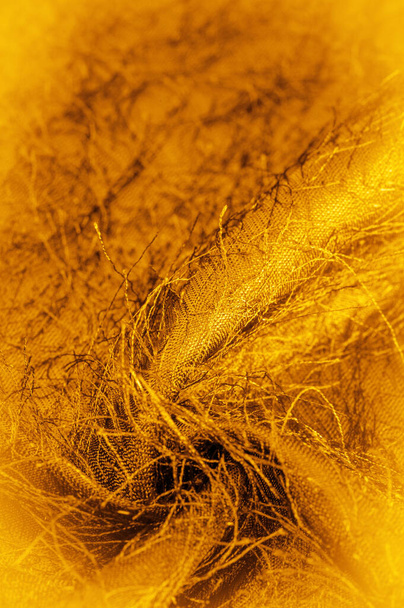 Background texture, decorative ornament, yellow gold silk fabric, woven threads on the fabric, fluffy effect, sensation, appearance or texture of a surface or substance - Photo, Image