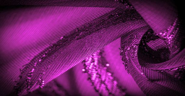 koriste sisustus, läpinäkyvä kangas on violetti-punainen kirkkaasti synnynnäisiä raitoja, materiaali mahdollistaa valon läpi niin, että esineet takana ovat selvästi näkyvissä
. - Valokuva, kuva