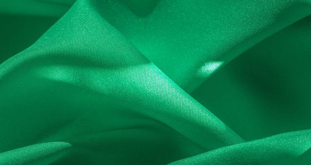 テクスチャ、緑色の絹の生地、公爵夫人の固体薄緑の絹のサテン生地サテンの光沢のある本当に美しい絹の生地。あなたのデザインのための理想的な、特別な機会結婚式の招待状 - 写真・画像