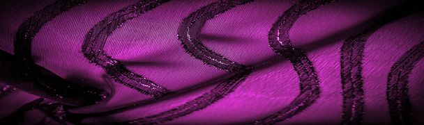 the ornament of the decor, the transparent fabric is purple-red with brightly innate stripes, the material allowing the light to pass through it so that the objects behind are clearly visible. - Photo, Image
