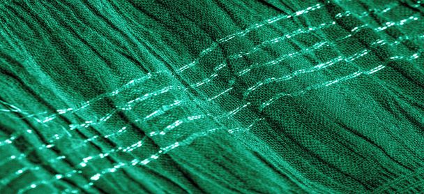 The texture of the background picture the color of the fabric under water, green-blue corrugated fabric, fabric with parallel or diagonal folds with serrated folds; products from such a fabric. - Photo, Image