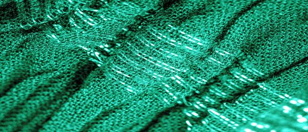 La textura de la imagen de fondo el color de la tela bajo el agua, tela corrugada verde-azul, tela con pliegues paralelos o diagonales con pliegues dentados; productos de dicha tela. - Foto, imagen