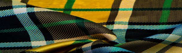 Texture, fond, motif, tissu à carreaux, couleurs jaune-vert-blanc-bleu, motifs écossais dans ce tissu, votre design avec les sons de cornemuses et de whisky parfumé - Photo, image