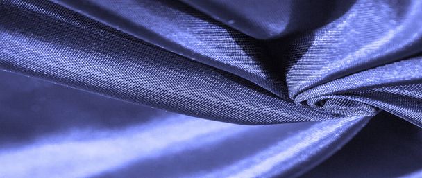 Фоновая текстура, узор, синяя шелковая ткань, декоративный дизайн. - Фото, изображение