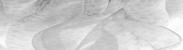 A textura, fundo, padrão, tecido de seda branca é têxtil. Suas propriedades diferem do material tecido, pois é mais flexível e mais fácil de projetar. - Foto, Imagem