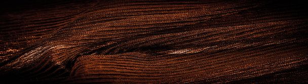 Tekstura, tło, wzór, krepa Sepia, jest tkaniną z jedwabiu, wełny lub włókien syntetycznych o wyraźnie przezroczystym, zaciśniętym wyglądzie.  - Zdjęcie, obraz